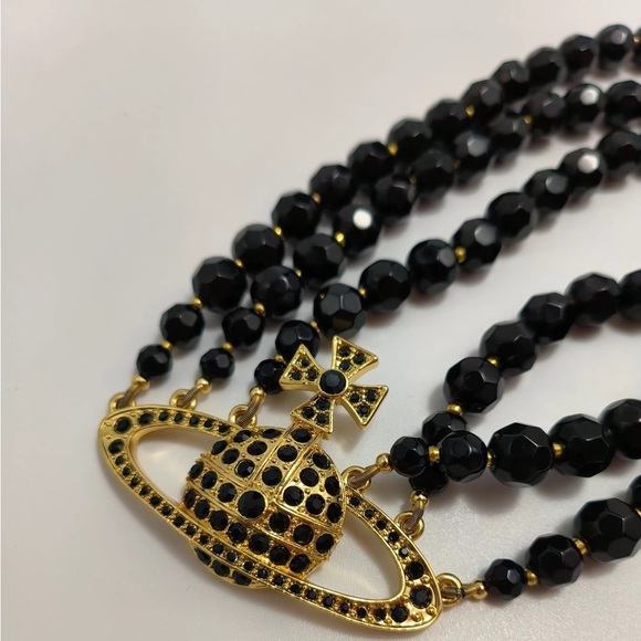 Vivienne Westwood Jewelry - Brand-new Vivienne Westwood three-strand necklace with gold-tone pendant